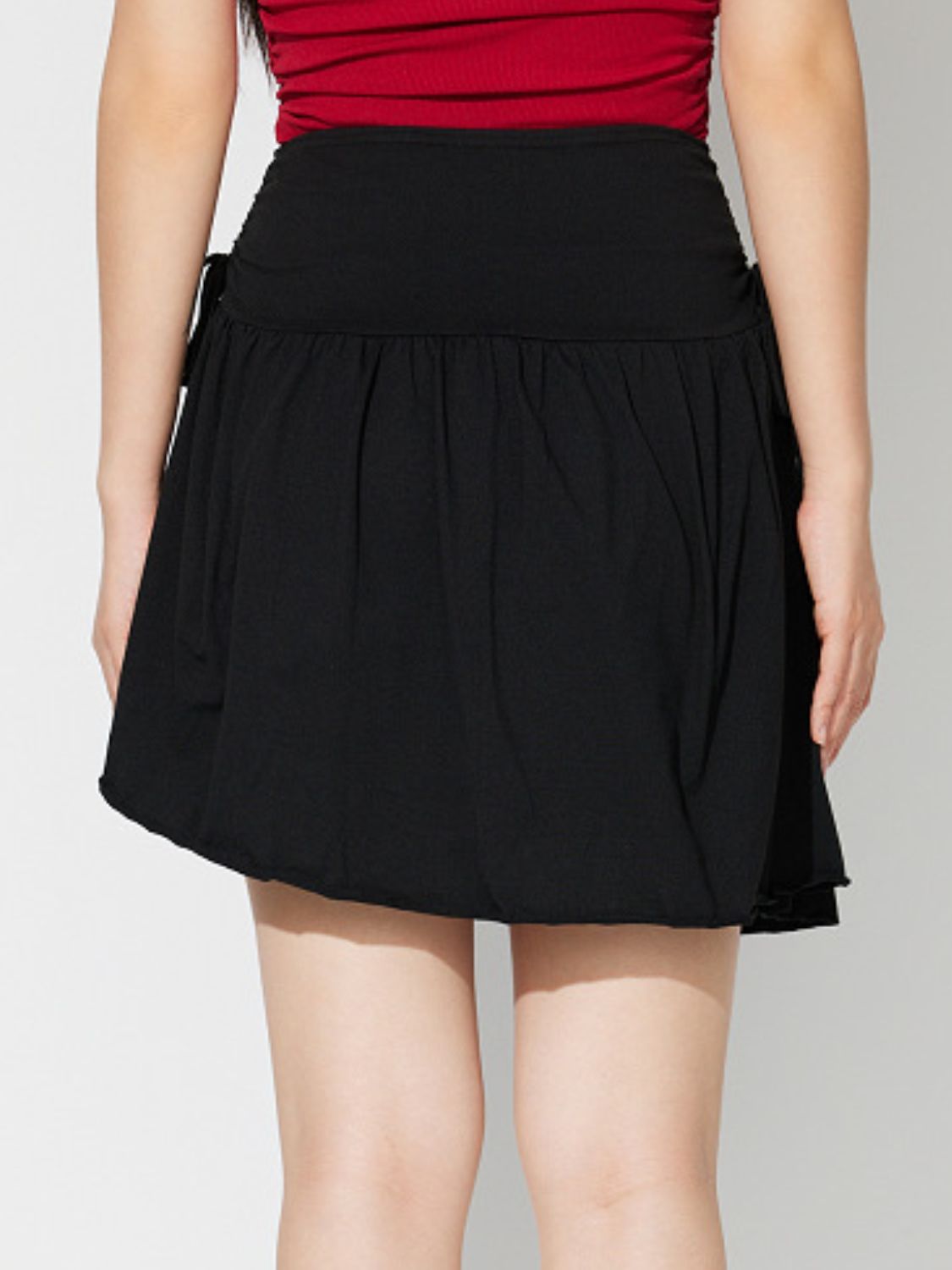 Side Tie Asymmetric Hem Mini Skirt